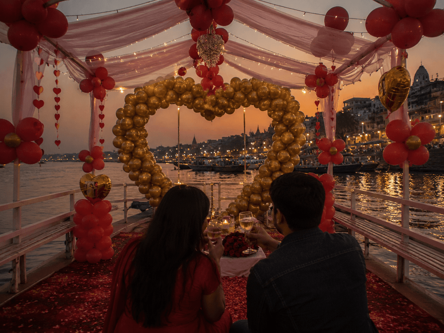 Couple toasting at sunset